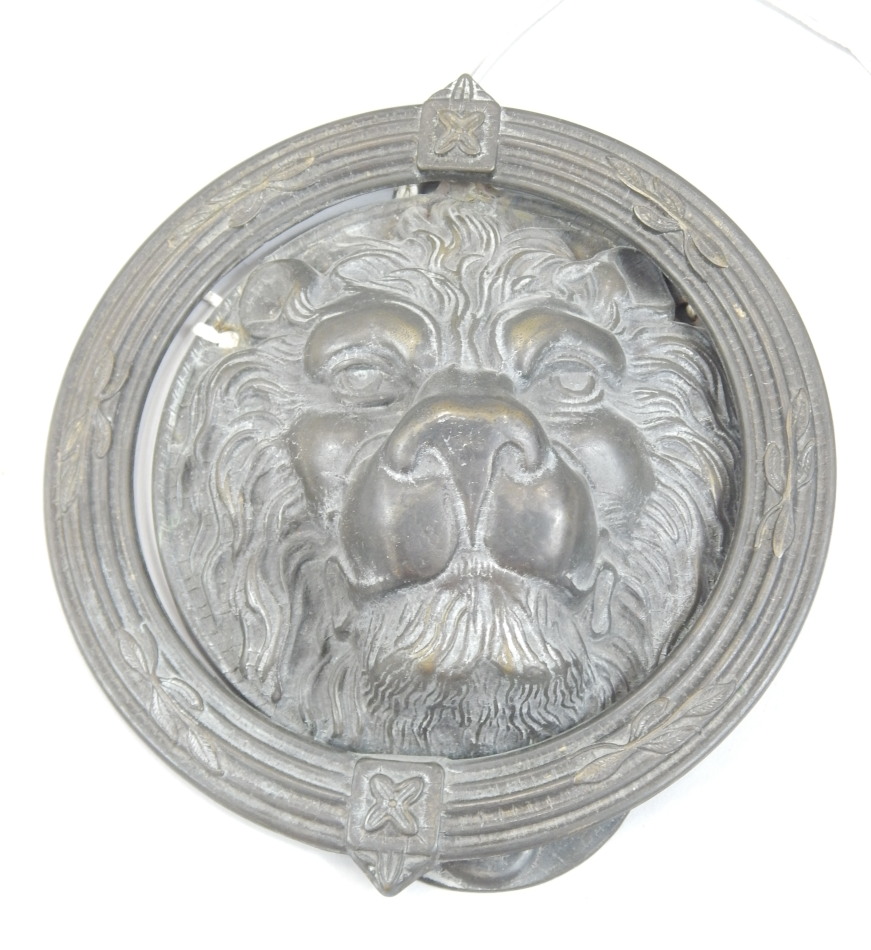 Appraisal: A bronze door knocker modelled in the form of a