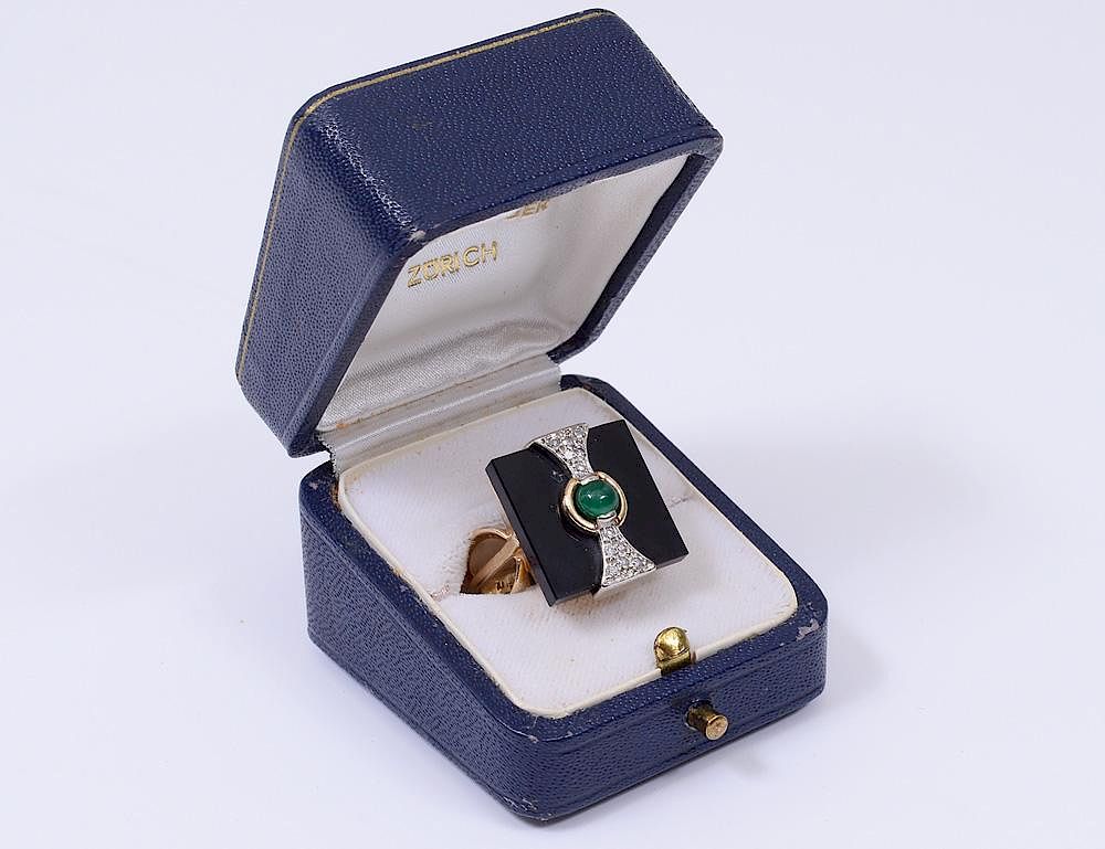 Appraisal: FOURTEEN KARAT YELLOW GOLD ONYX DIAMOND AND EMERALD RING Set