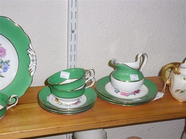 Appraisal: A PORCELAIN PART TEA SET with flower sprays and apple