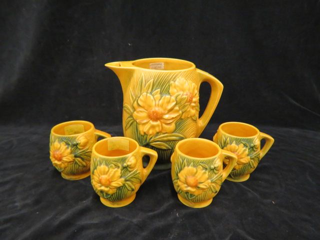 Appraisal: Roseville Pottery Peony Beverage Set yellow-brown pitcher with ice lip