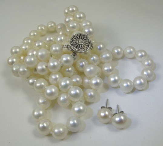 Appraisal: THREE ARTICLES OF PEARL JEWELRY including a double strand necklace