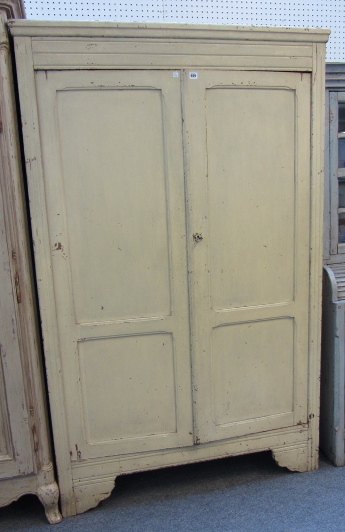 Appraisal: A French pine two door cupboard with original cream paint