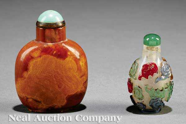 Appraisal: Two Chinese Snuff Bottles the first carved stone with a