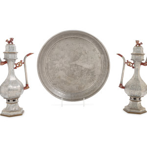 Appraisal: A Pair of Chinese Pewter Wine Ewers and a Chinese