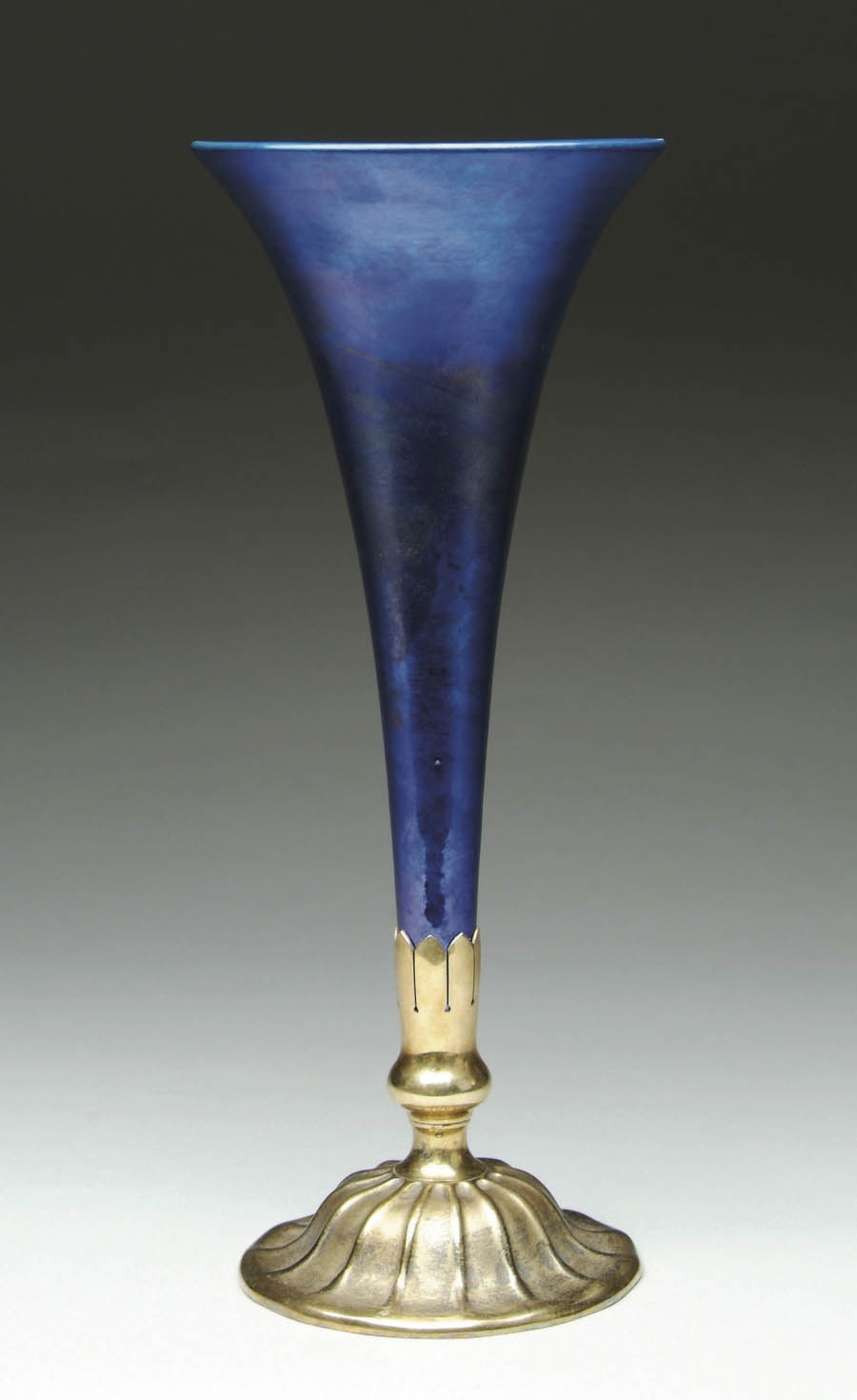 Appraisal: TIFFANY TRUMPET VASE Strong blue-purple iridescent vase Big size Gilded