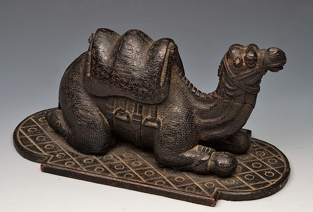 Appraisal: A MIDDLE EASTERN CARVED WOODEN MODEL of a seated camel