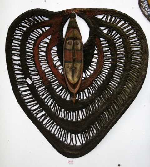 Appraisal: A woven yam fan decorated with ochre with a carved