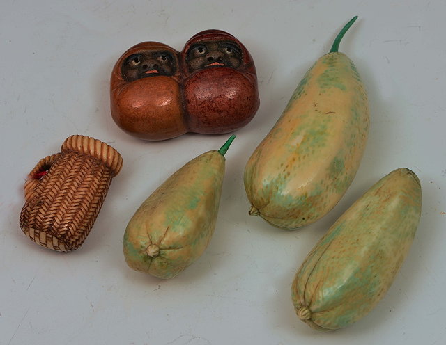 Appraisal: Three Japanese stained ivory gourdscirca a miniature ivory basket and