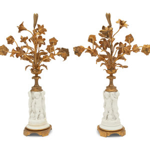 Appraisal: A Pair of Gilt Metal Mounted Bisque Porcelain Figural Ornaments