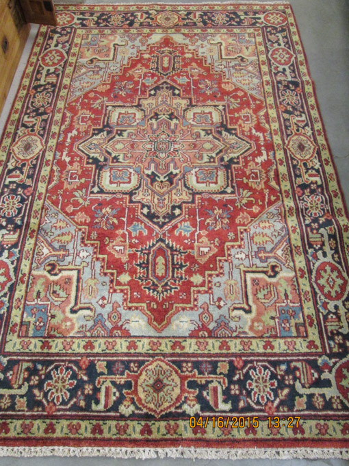 Appraisal: HAND KNOTTED ORIENTAL CARPET Persian Serapi design with central geometric