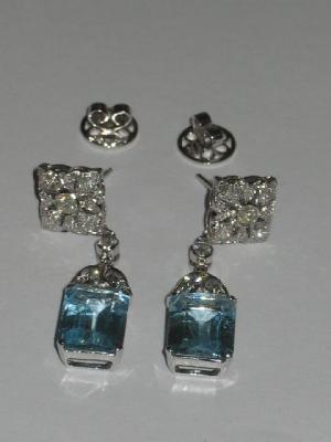 Appraisal: A PAIR OF AQUAMARINE AND DIAMOND EARRINGS comprising an emerald