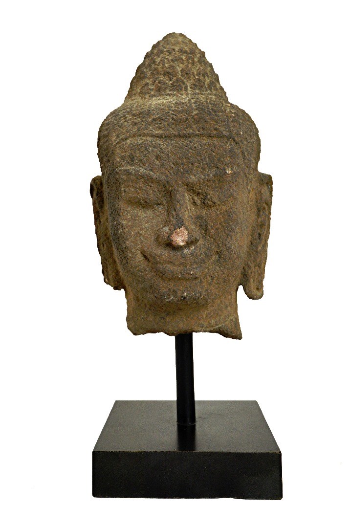 Appraisal: An Indonesian stone head of Buddha Shakyamuni possibly th century