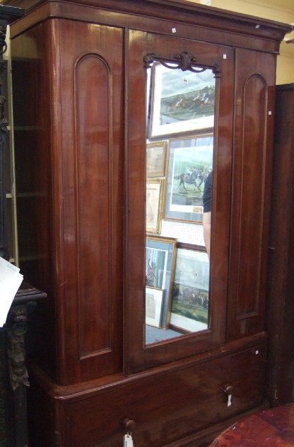 Appraisal: A Victorian mahogany wardrobe the moulded cornice over a single