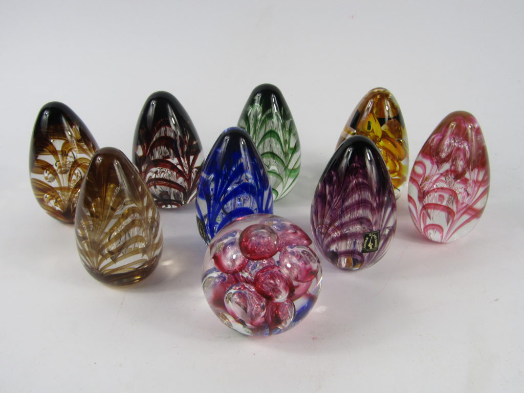 Appraisal: Langham glass paperweights with feathered and air bubble inclusion decoration