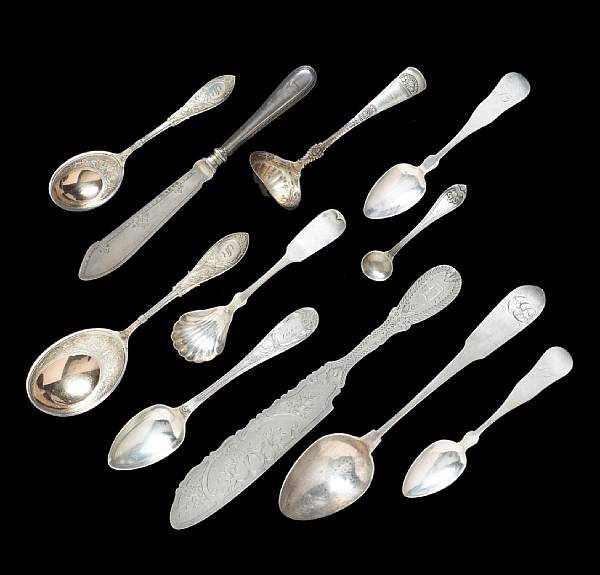 Appraisal: A silver flatware group Comprising coin dessert spoon engraved with