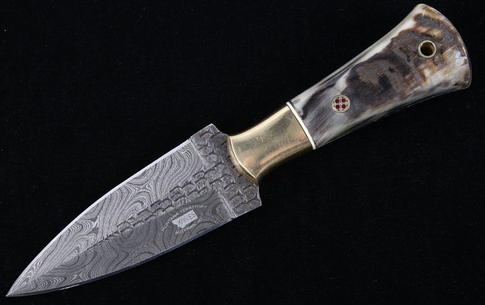 Appraisal: M T Knives Rams Horn Damascus Hammered Knife This is