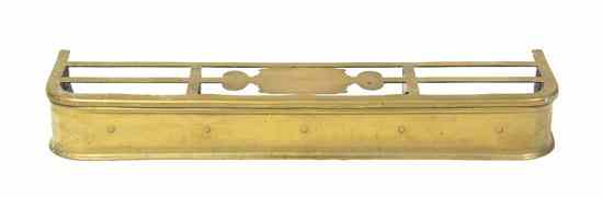 Appraisal: An English Brass Fire Fender having an openwork top over