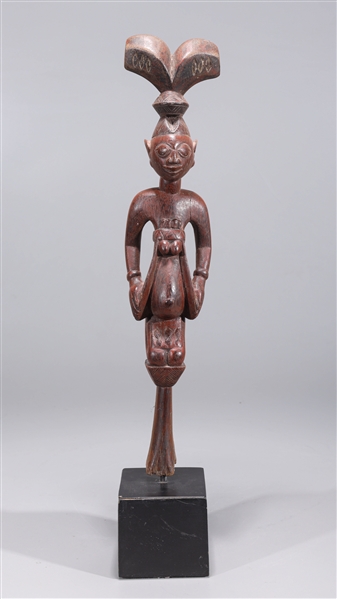 Appraisal: Intricately carved wood topper of an African tribal staff depicting