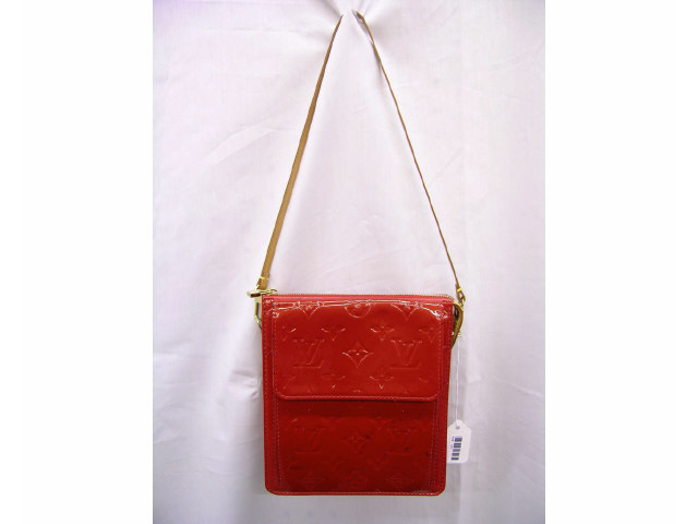 Appraisal: Louis Vuitton handbag monogrammed red vernis with tan leather strap