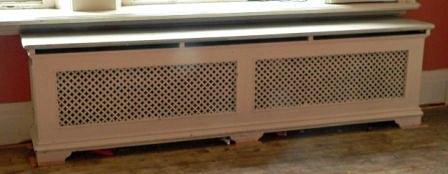 Appraisal: A double pierced cast radiator surround with pierced ends and