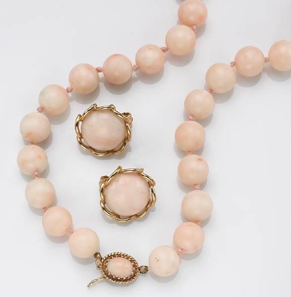 Appraisal: A white and pink coral and k gold bead necklace