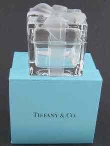 Appraisal: A square glass box ''tied'' with opaque moulded ribbon in