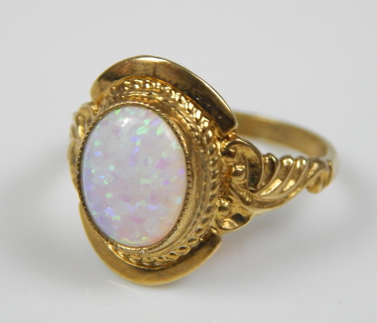 Appraisal: A modern dress ring with central opal effect stone marked