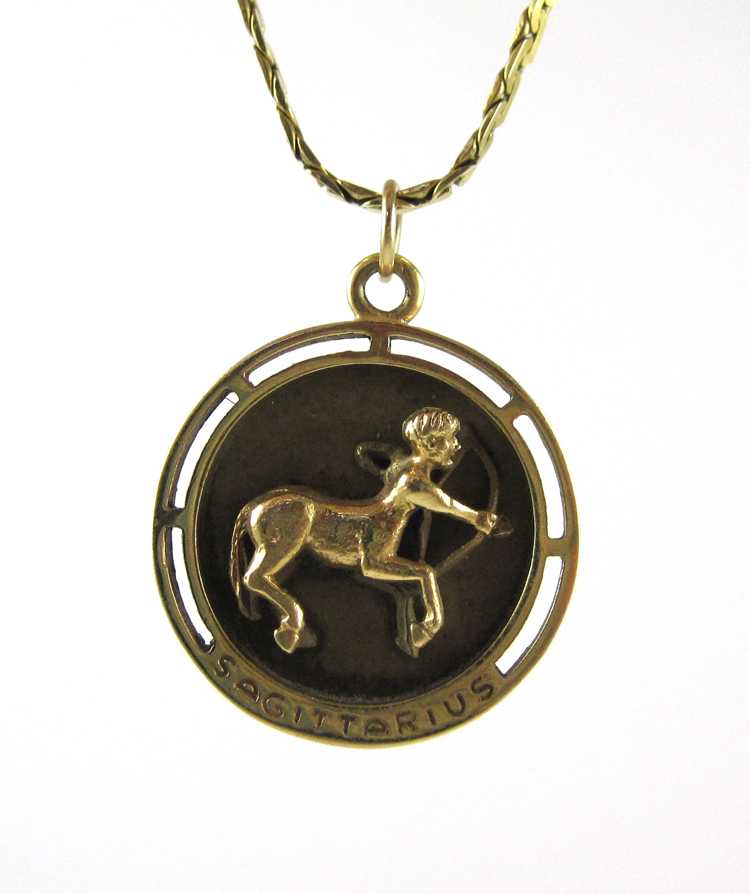 Appraisal: SAGITTARIUS ZODIAC FOURTEEN KARAT GOLD PENDANT NECKLACE suspended on a