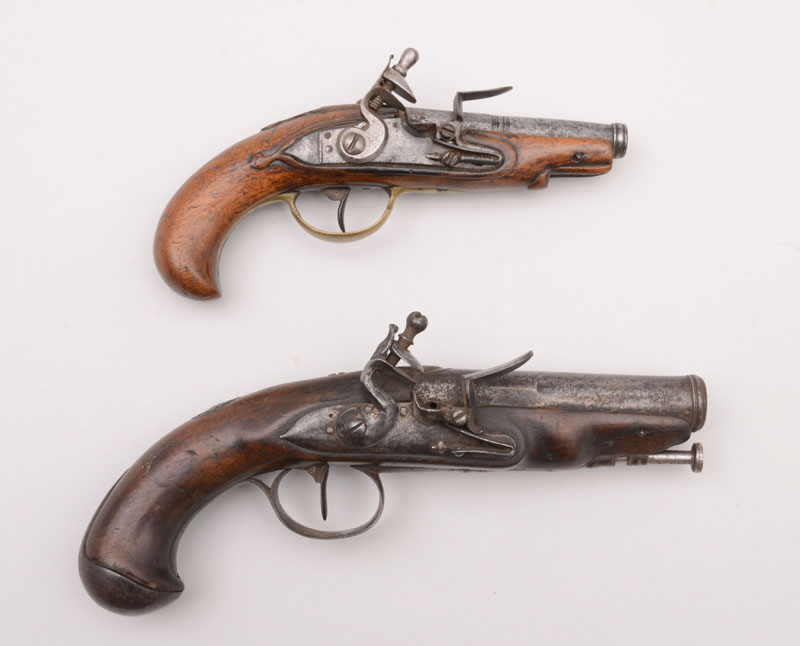 Appraisal: TWO FLINTLOCK PISTOLS One a French iron-mounted pistol the other