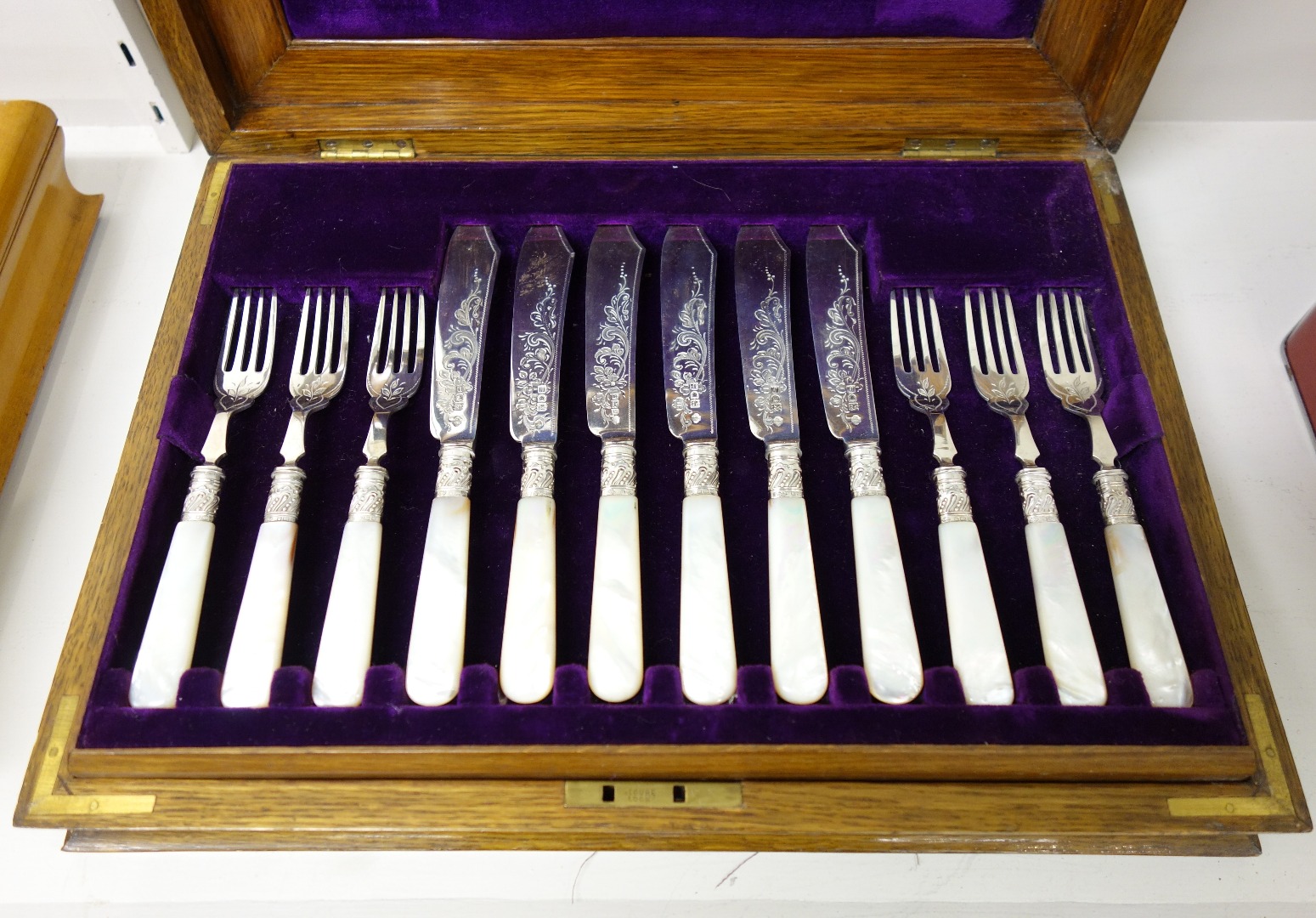 Appraisal: Twelve silver bladed fish knives and twelve silver fish forks