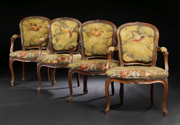 Appraisal: Suite of Four Provincial Louis XV Fruitwood Fauteuils early th