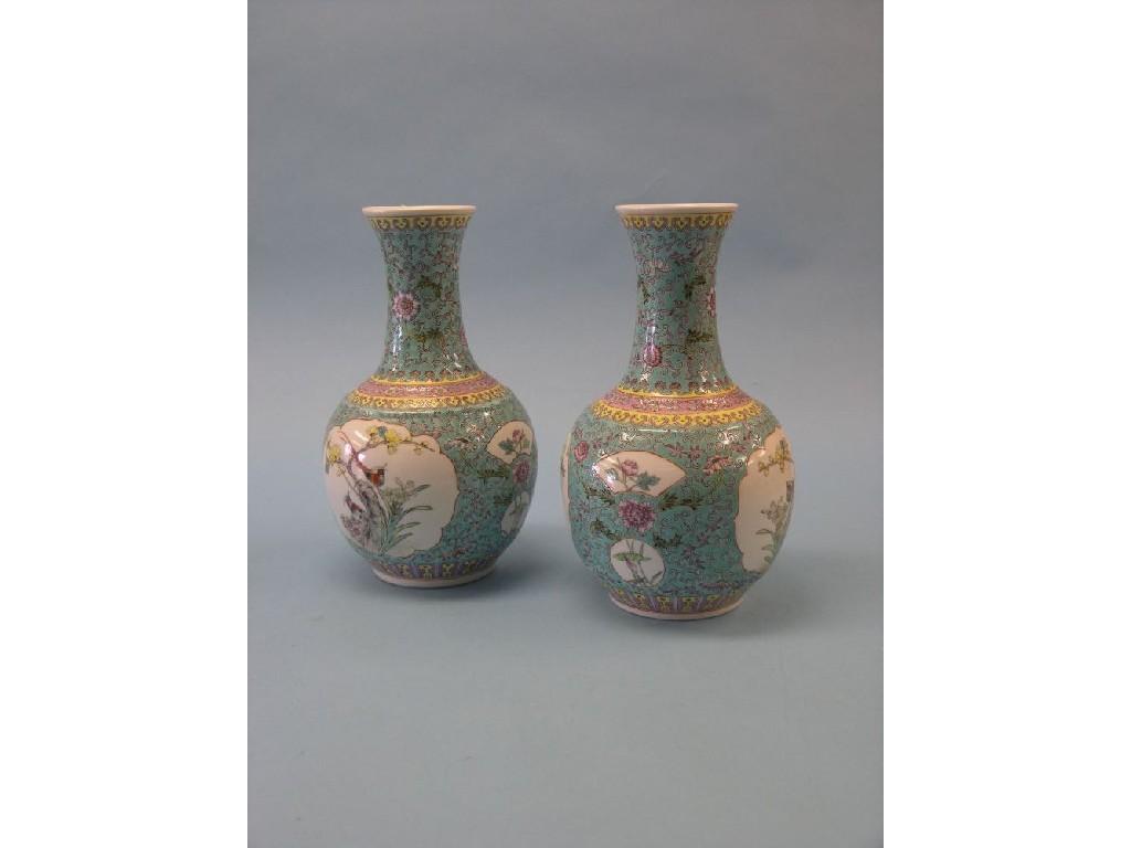 Appraisal: A pair of Chinese porcelain vases globe-and-shaft form brightly enamelled