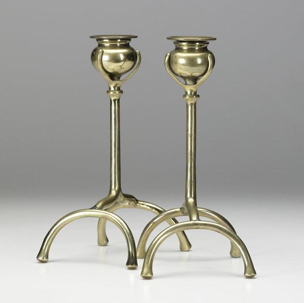 Appraisal: ARTS CRAFTS Footed brass candlesticks with detachable bobeches th C