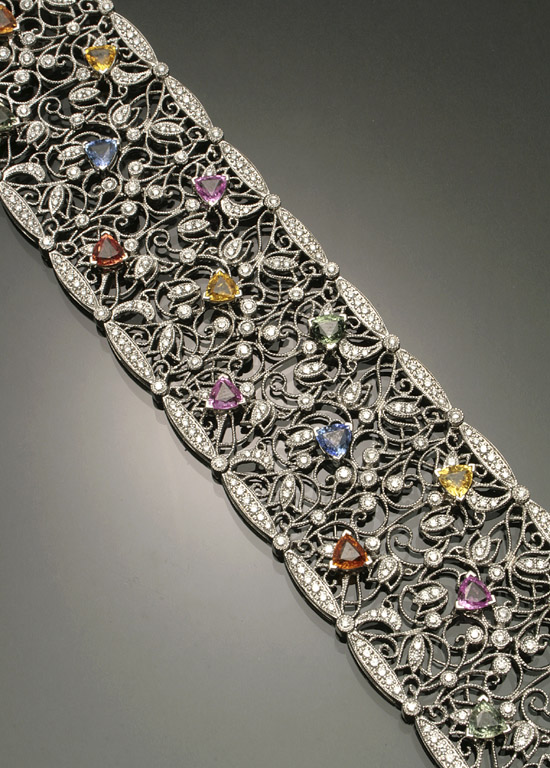 Appraisal: -Karat White-Gold Diamond and Multi-Colored Sapphire Cocktail Bracelet The reticulated