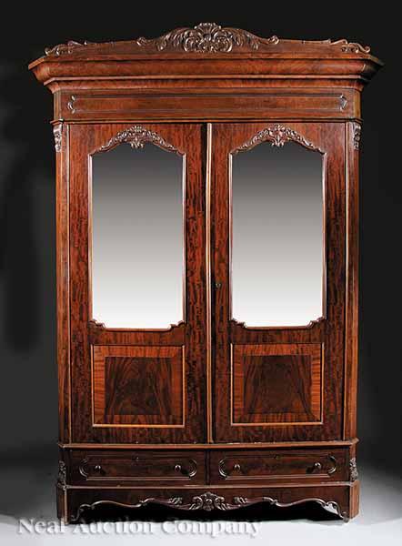 Appraisal: An American Rococo Carved Mahogany Armoire c - foliate and