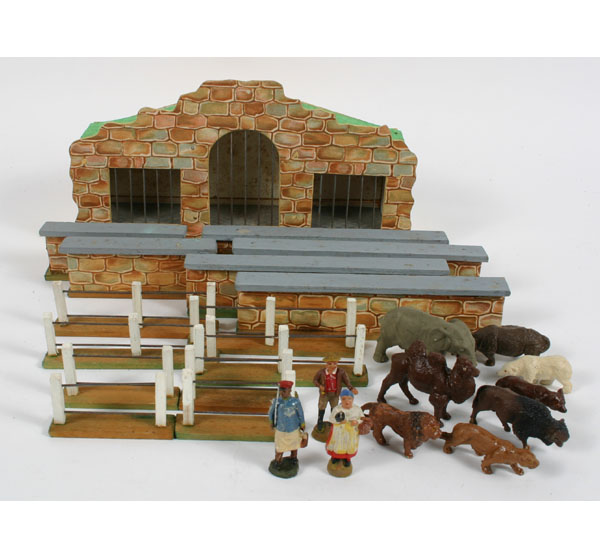 Appraisal: German composition exotic animal playset large cage with metal bars