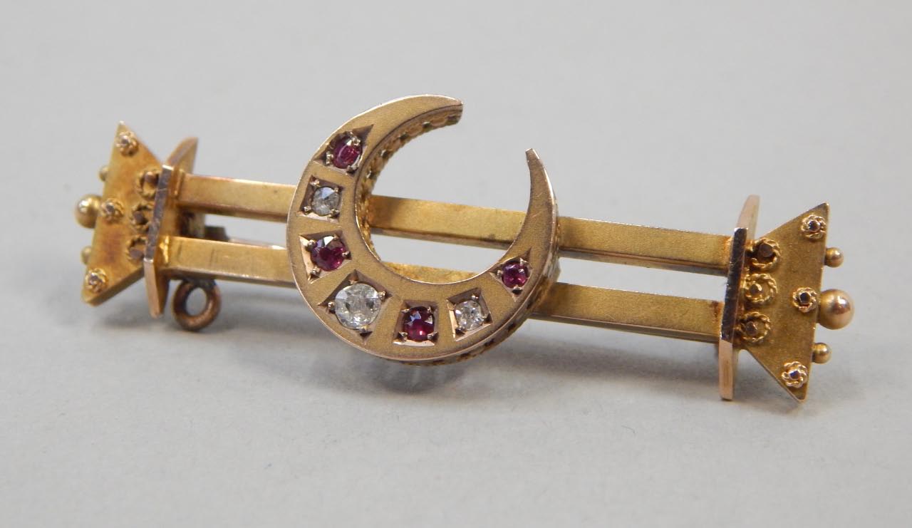 Appraisal: A Victorian bar brooch set with rubies and diamonds in