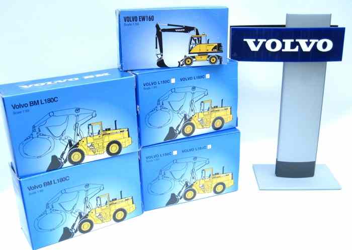 Appraisal: FIVE DIECAST SCALE MODELS OF VOLVO CONSTRUCTION EQUIPMENT PLUS TABLE