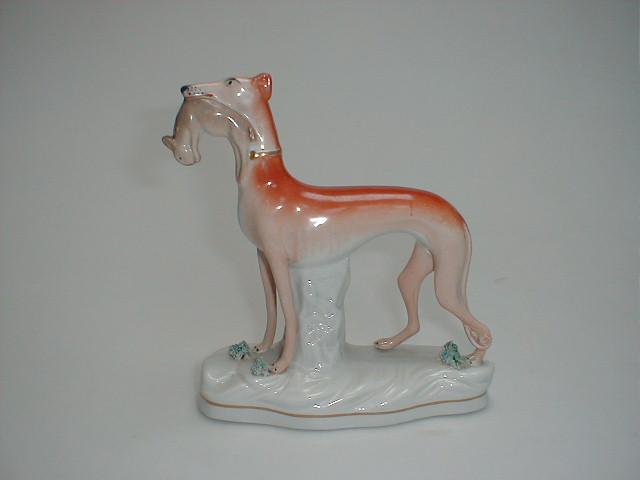 Appraisal: A Staffordshire type figure of a greyhound with dead hare