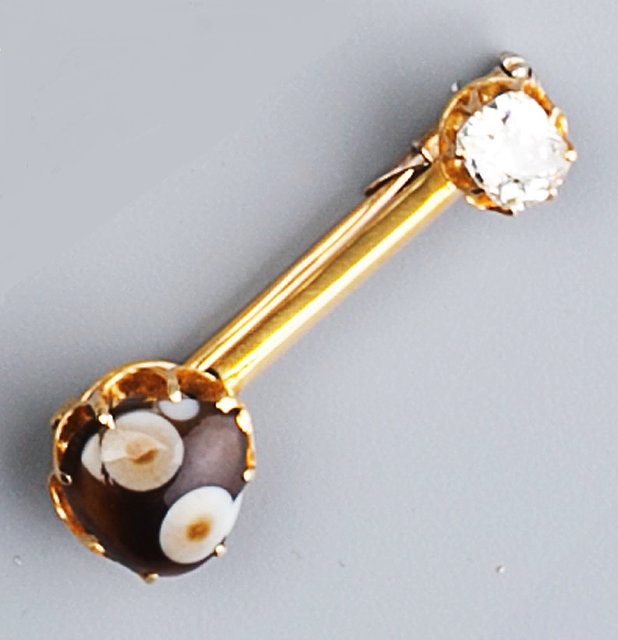 Appraisal: A diamond and hardstone brooch the uniform bar with claw