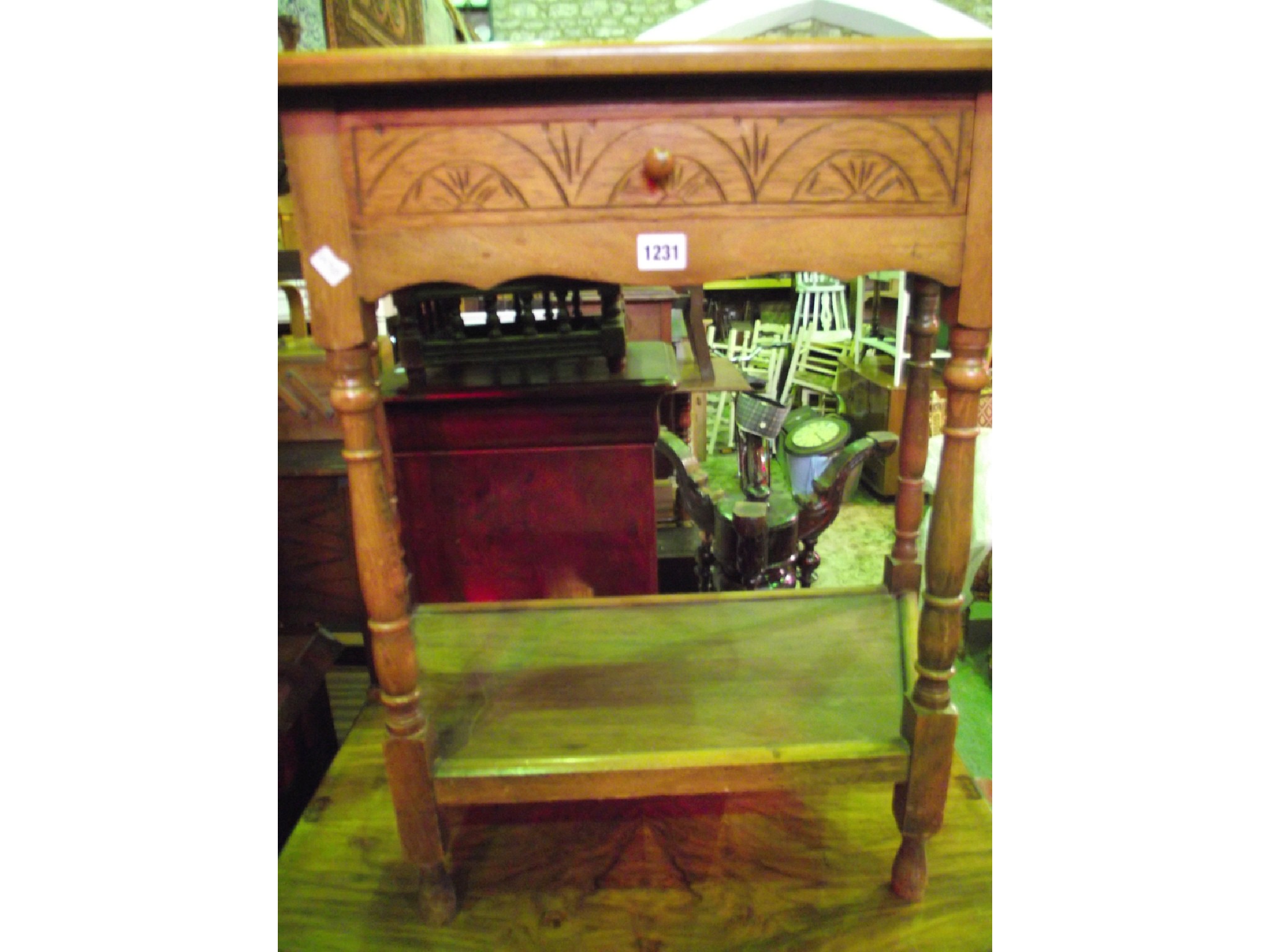 Appraisal: A reproduction stained beechwood breakfront side table in the Old