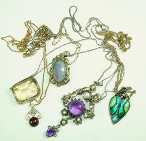 Appraisal: A Collection of pendants with chains to include a yellow