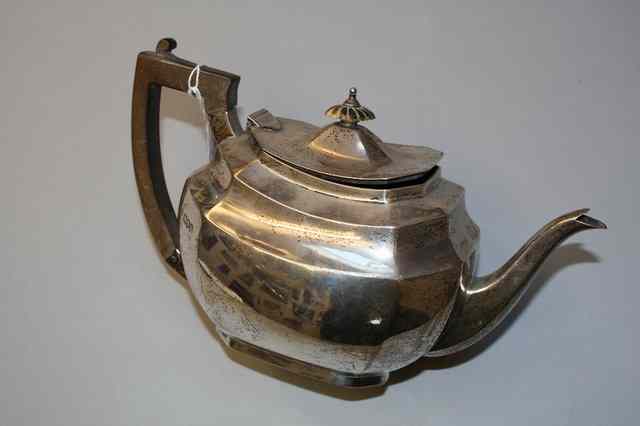 Appraisal: A GEORGE V SILVER TEAPOT oval shaped with canted sides