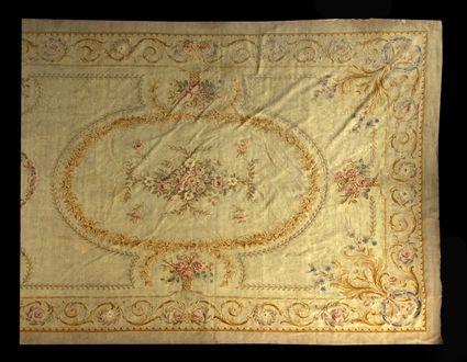 Appraisal: AUBUSSON CARPET The tan field with circular floral wreaths and