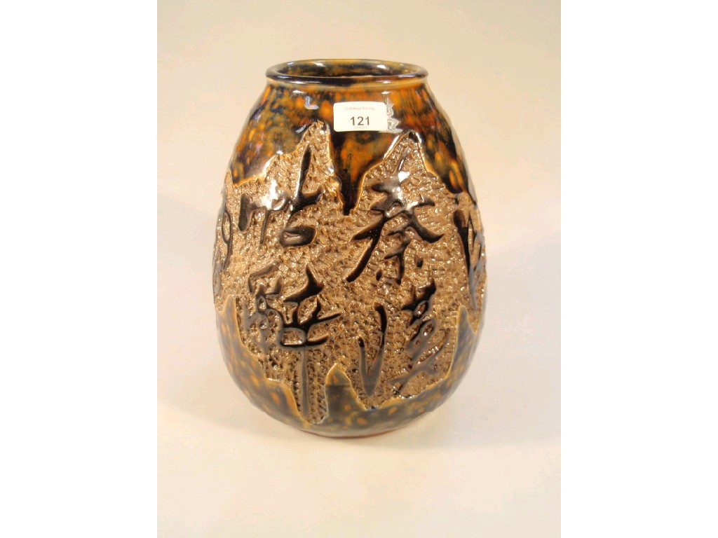 Appraisal: An earthenware ovoid studio vase decorated with a band of