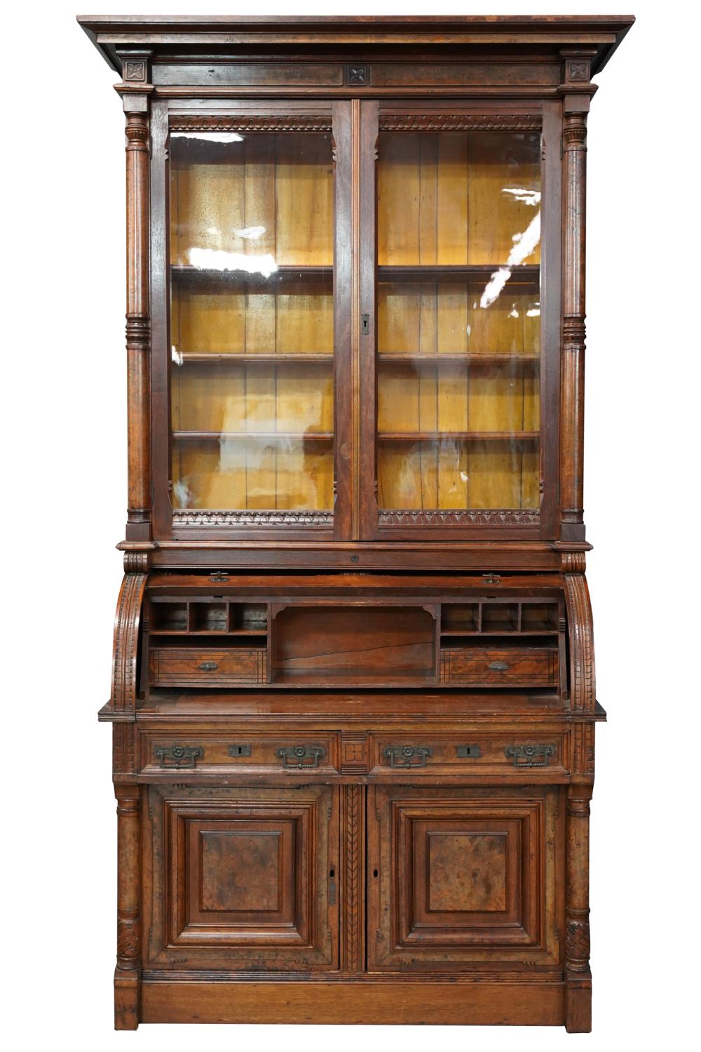 Appraisal: EASTLAKE CYLINDER SECRETARY BOOKCASEwith burl veneer panels constructed in two