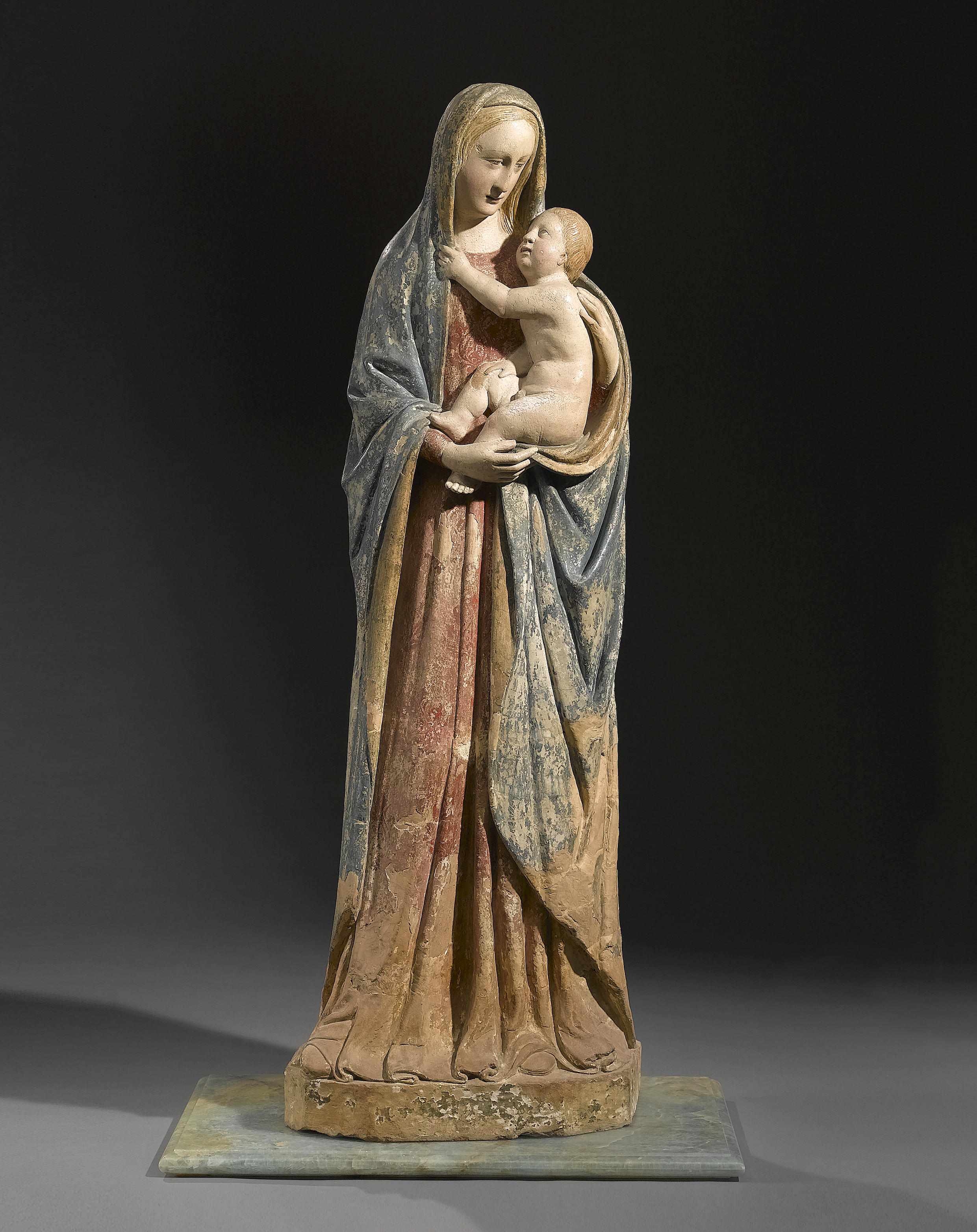 Appraisal: A large Italian polychrome decorated terracotta figure of the Virgin