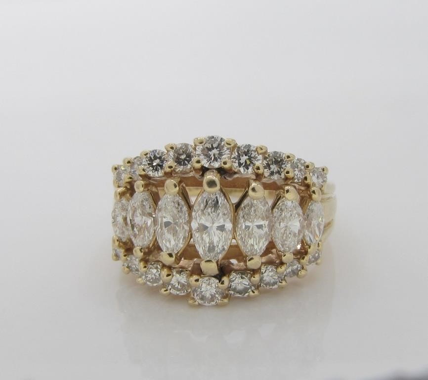 Appraisal: A stunning K yellow gold three-row ring Center row contains