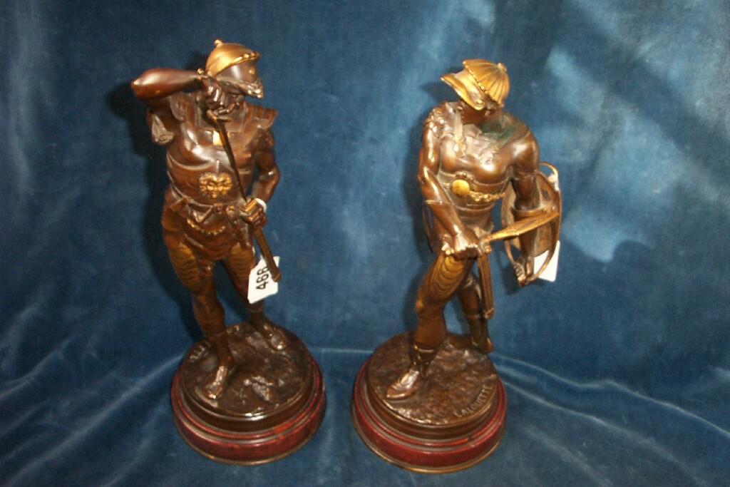 Appraisal: A pair of th century cast bronze figures of classical