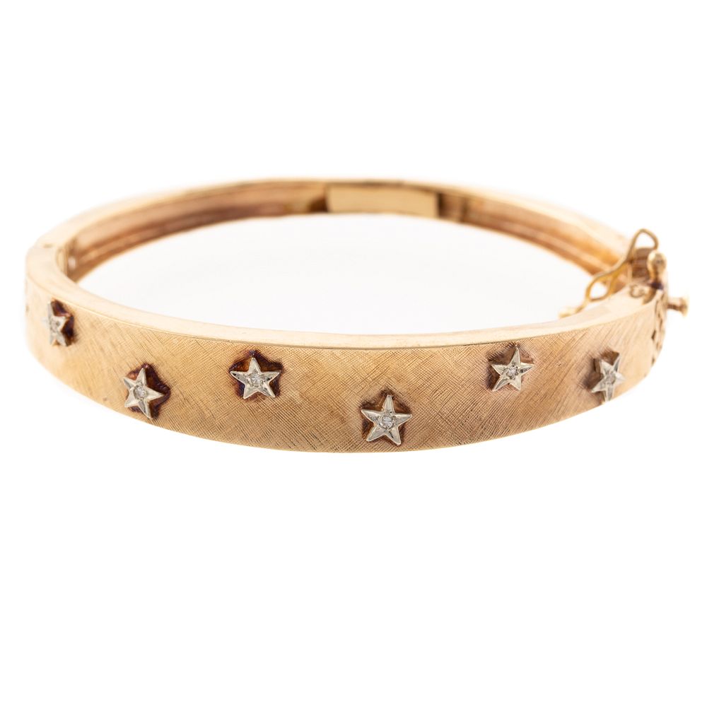 Appraisal: A Diamond Star Hinged Bangle in K K yellow gold